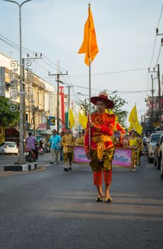 PHUKET, THAILAND - 07 FEB 2014: Phuket town residents take part in procession parade of annual old Phuket town festival. 