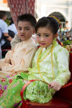 PHUKET, THAILAND - 07 FEB 2014: Small children take part in procession parade of annual old Phuket town festival. 
