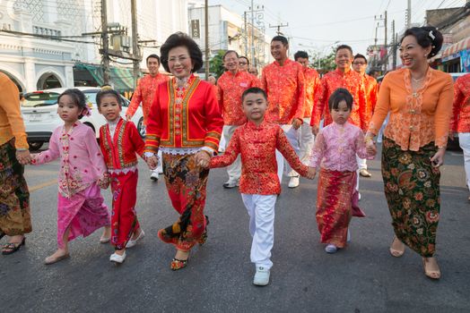 PHUKET, THAILAND - 07 FEB 2014: Phuket town residents take part in procession parade of annual old Phuket town festival. 