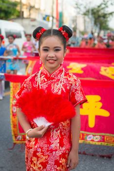 PHUKET, THAILAND - 07 FEB 2014: Beautiful girl take part in procession parade of annual old Phuket town festival. 