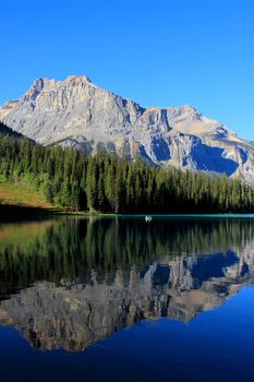 Mountains reflected in Emerald Lake, Yoho National Park, British Columbia, Canada