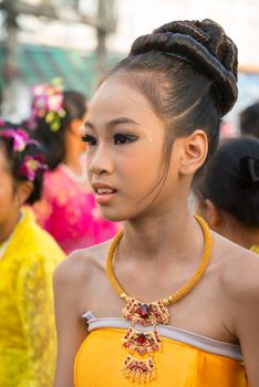 PHUKET, THAILAND - 07 FEB 2014: Beautiful young woman take part in procession parade of annual old Phuket town festival. 