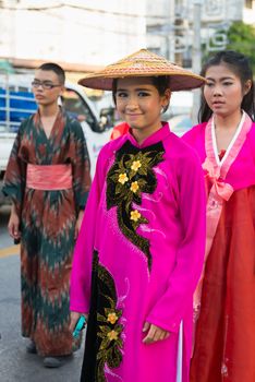 PHUKET, THAILAND - 07 FEB 2014: Phuket town residents take part in procession parade of annual old Phuket town festival. 