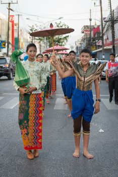 PHUKET, THAILAND - 07 FEB 2014: Phuket town residents take part in procession parade of annual old Phuket town festival. 