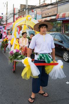 PHUKET, THAILAND - 07 FEB 2014: Rickshas with passenger  take part in procession parade of annual old Phuket town festival. 