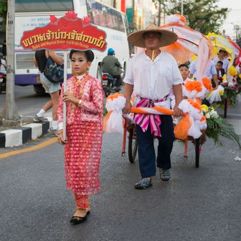 PHUKET, THAILAND - 07 FEB 2014: Phuket town residents take part in procession parade of annual old Phuket town festival. 