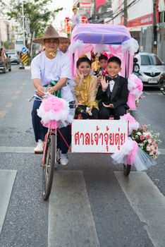 PHUKET, THAILAND - 07 FEB 2014: Rickshas with passenger  take part in procession parade of annual old Phuket town festival. 