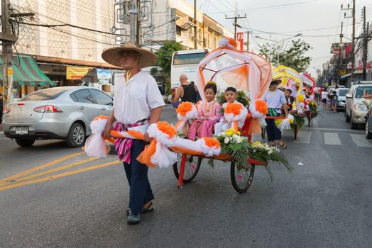 PHUKET, THAILAND - 07 FEB 2014: Rickshas with passenger  take part in procession parade of annual old Phuket town festival. 