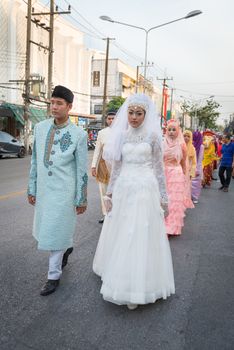 PHUKET, THAILAND - 07 FEB 2014: Phuket town residents in muslim wedding dress take part in procession parade of annual old Phuket town festival. 