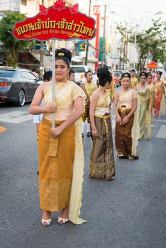 PHUKET, THAILAND - 07 FEB 2014: Phuket town residents take part in procession bride parade of annual old Phuket town festival. 