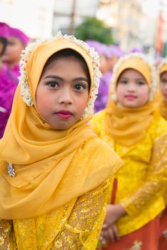 PHUKET, THAILAND - 07 FEB 2014: Children in muslim headscarf take part in procession parade of annual old Phuket town festival. 