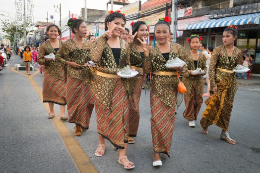 PHUKET, THAILAND - 07 FEB 2014: Phuket town residents take part in procession parade of annual old Phuket town festival. 