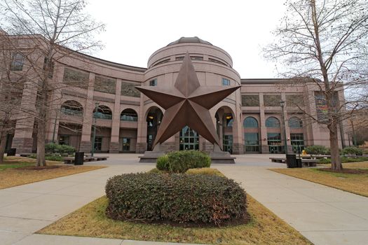 AUSTIN, TEXAS - FEBRUARY 3 2014: Front facade of the Bullock Texas State History Museum in Austin. This popular museum tells the Story of Texas and has been visited by more than 6 million people.