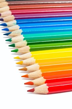 Close up photo of colour pencils isolated on white background