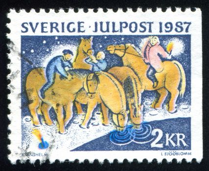 SWEDEN - CIRCA 1987: stamp printed by Sweden, shows Watering horses at a north running stream on
Boxing Day, circa 1987