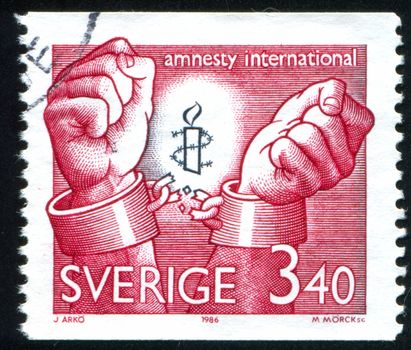 SWEDEN - CIRCA 1986: stamp printed by Sweden, shows Amnesty International emblem, circa 1986