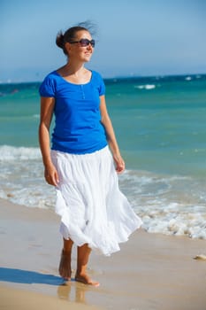 Beautiful happy smiling woman on beach vacation
