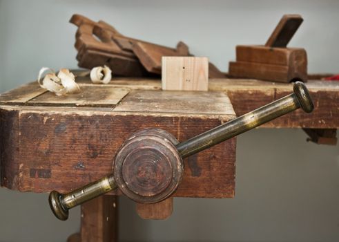 Old wooden vise and tool in a workshop. All wooden