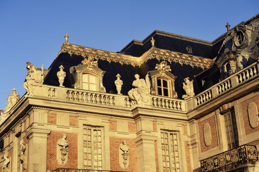 chateau de Versailles, architectural detail and gilding of the facade and roof