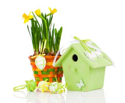 Easter eggs with birdhouse, on a white background