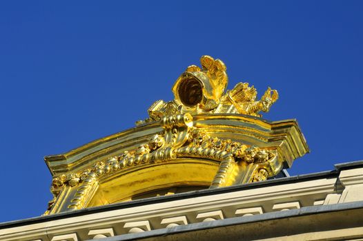 Castle of Versailles, architectural detail and gilding of the facade and roof