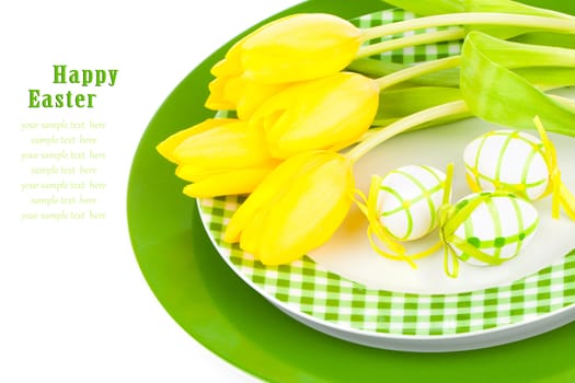 Easter eggs in a bplate, on a white background