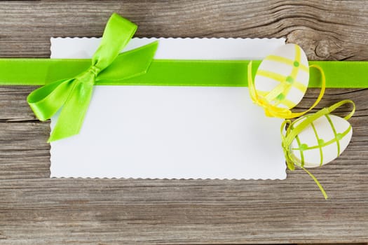 easter eggs and blank for text, on wooden background