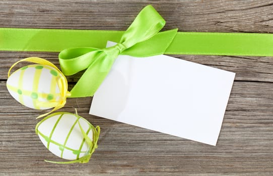 easter eggs and blank for text, on wooden background