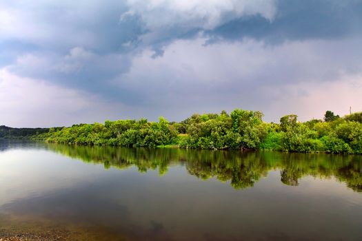 Nature Landscape with Small River and Dramatic Clouds