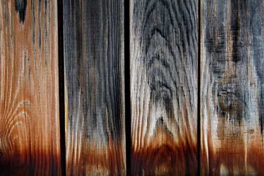 Vintage wooden planks with burned edges