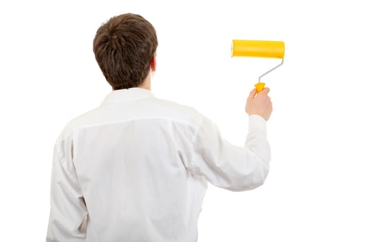 Rear view of the Young Man with Paint Roller Isolated on the White Background