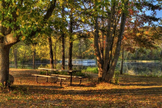 An HDR landscape of a forest and pond.