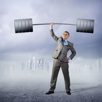 businessman holding a barbell with one hand, the concept of achievements in business