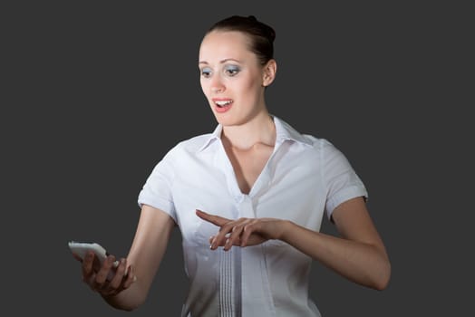 image of young business woman holding a cell phone