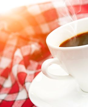 cup of coffee is on a white saucer