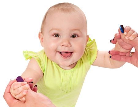 Woman hand helping a baby to walk on a white isolated background