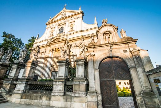 KRAKOW, POLAND - AUGUST 24: The early Baroque Church of St. Peter and St. Paul and the statues of the twelve apostles on Grodzka in the city of Krakow in Poland on 24 august 2013. Dates from 1596.