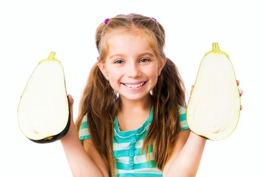 little girl with eggplant halves on a white background