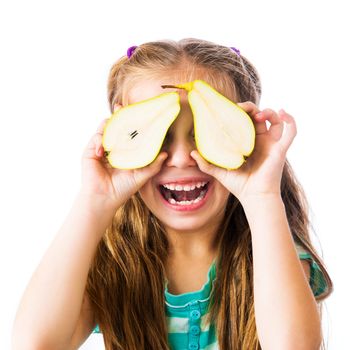 little girl with two halves of pears on a white background