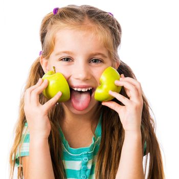 little girl with two halves of an apple isolated on white background