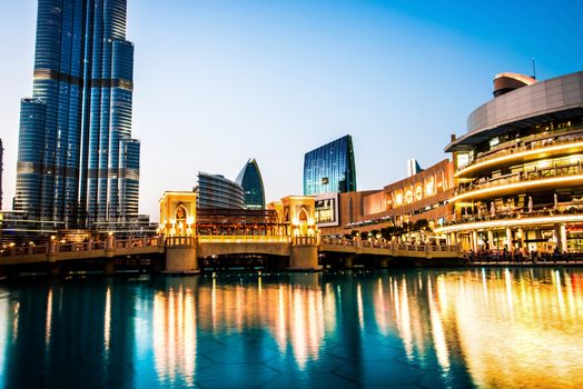 DUBAI, UAE -DECEMBER 11: Dubai Mall and the Dubai Fountain on December 11, 2013 in Dubai, UAE. The Dubai Mall is the largest shopping mall in the world with some 1200 stores