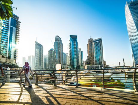 DUBAI, UAE -DECEMBER 14: Modern buildings in Dubai Marina, on december 14, 2013, Dubai, UAE. In the city of artificial channel length of 3 kilometers along the Persian Gulf.