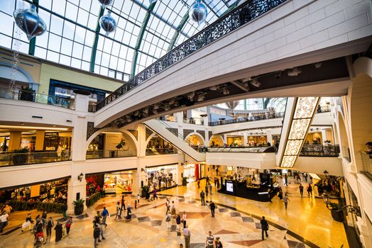 DUBAI, UAE - DECEMBER 19: Shoppers at Mall of the Emirates on December 19, 2013 in Dubai. Mall of the Emirates is a shopping mall before christmas in the Al Barsha district of Dubai.