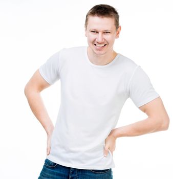 smiling young man in a white t shirt isolated on white background