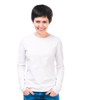 Smiling brunette woman in white blouse and jeans. Isolated on white
