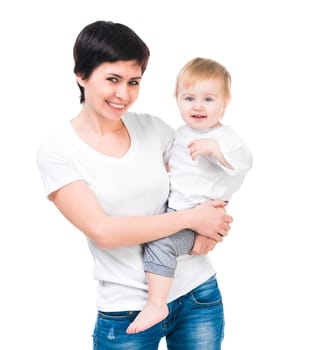 Brunette holding a baby in her arms. Isolated on white