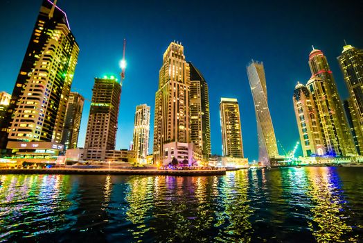 DUBAI, UAE - DECEMBER 14: View of the region of Dubai - Dubai Marina is an artificial canal city, carved along a two mile (3 km) stretch of Persian Gulf shoreline on december 14, 2013, Dubai, UAE.