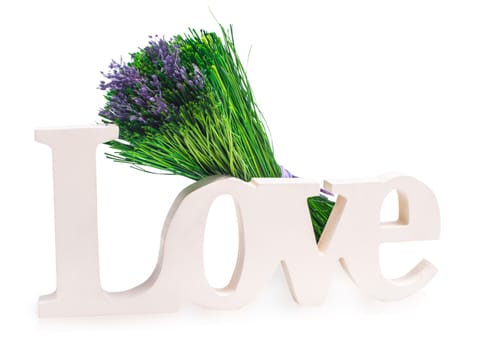 Sign of love with a bunch of green grass with purple Lavender. Isolated on white