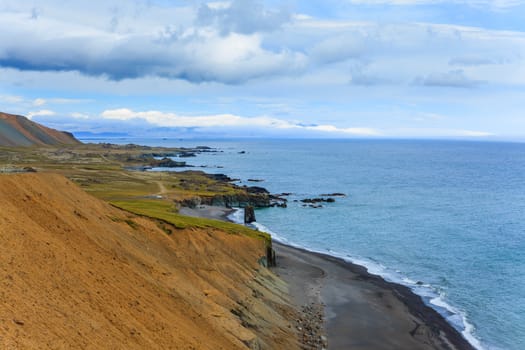 Cloudy sky over the coast in the East Fjords Iceland.