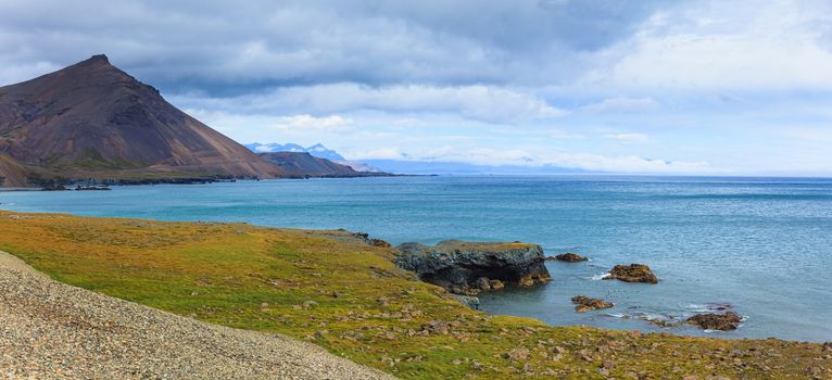 Cloudy sky over the coast in the East Fjords Iceland. Panorama